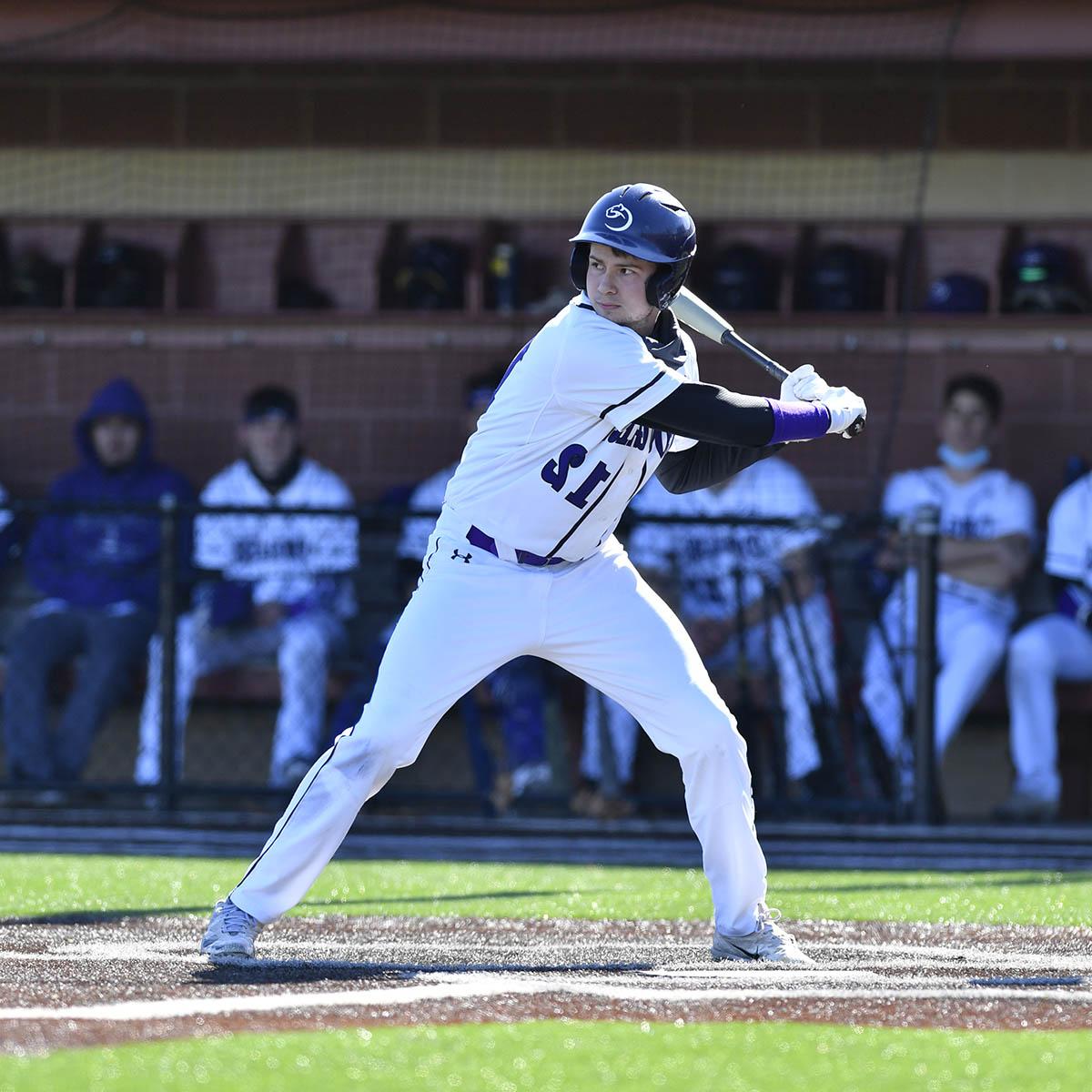 Photo of a young male student in a Chatham baseball uniform at bat